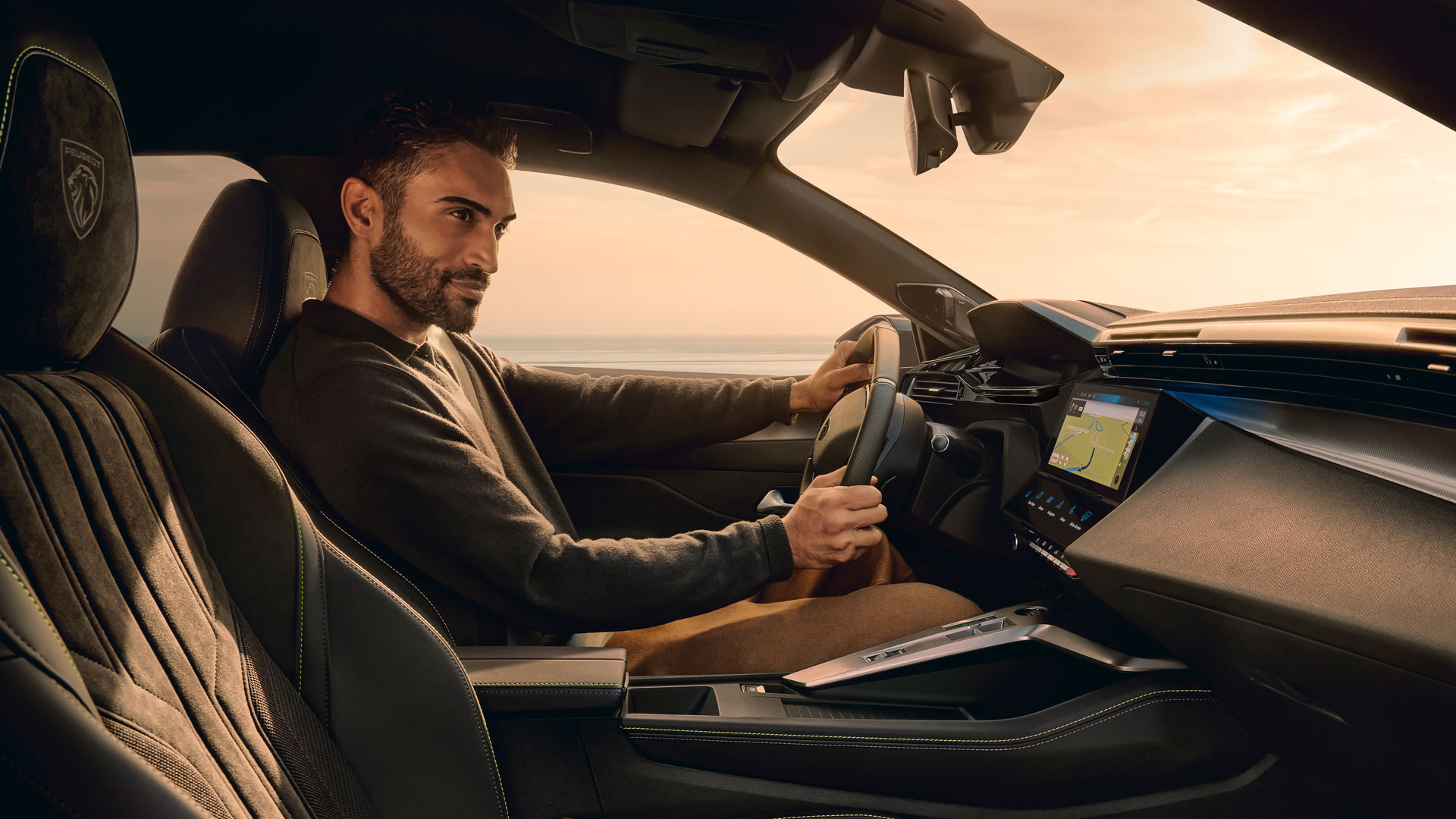 Man driving a Peugeot E-408